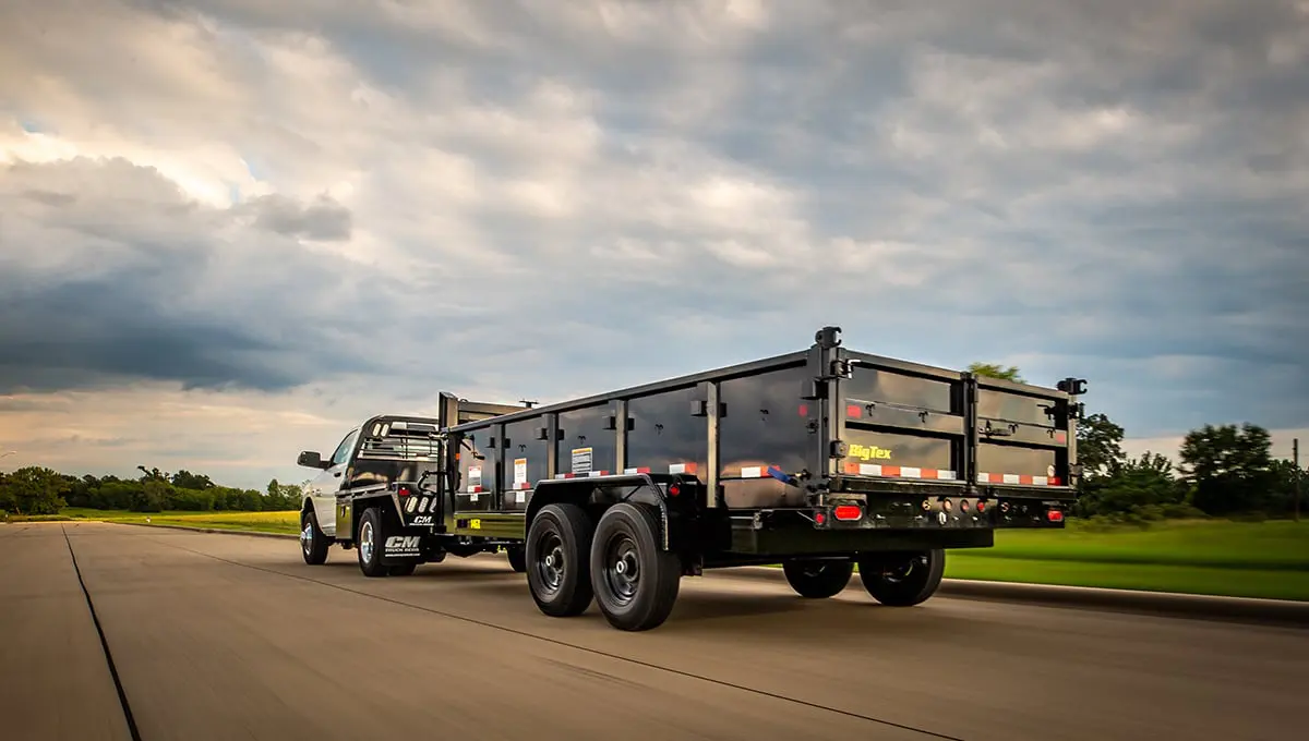 a 14gx commercial grade dump trailer that says bigflex on the back