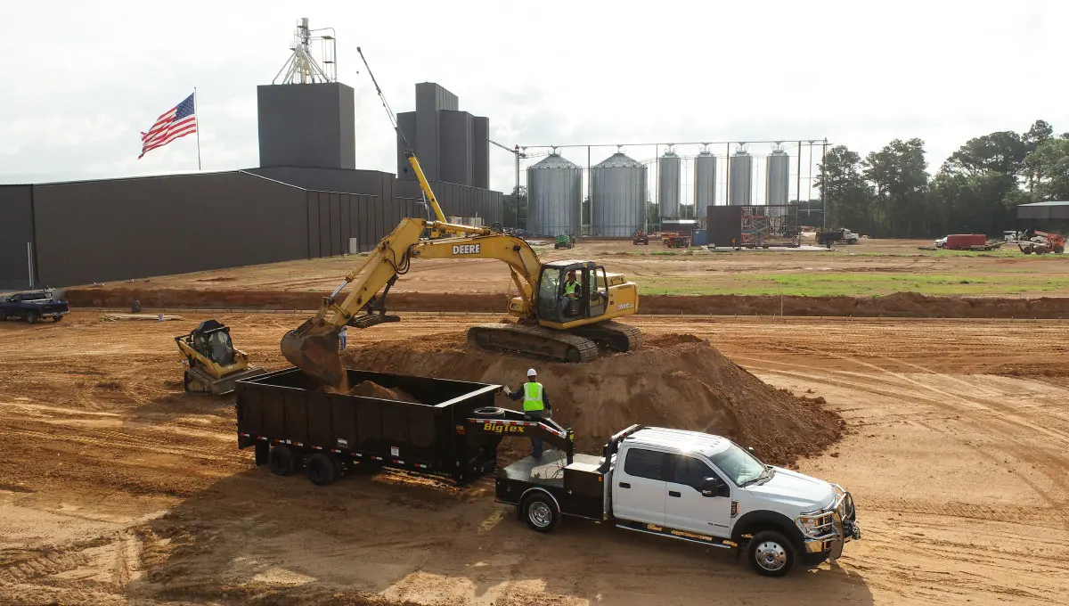 Big Tex 25DU dump trailer being loaded with dirt