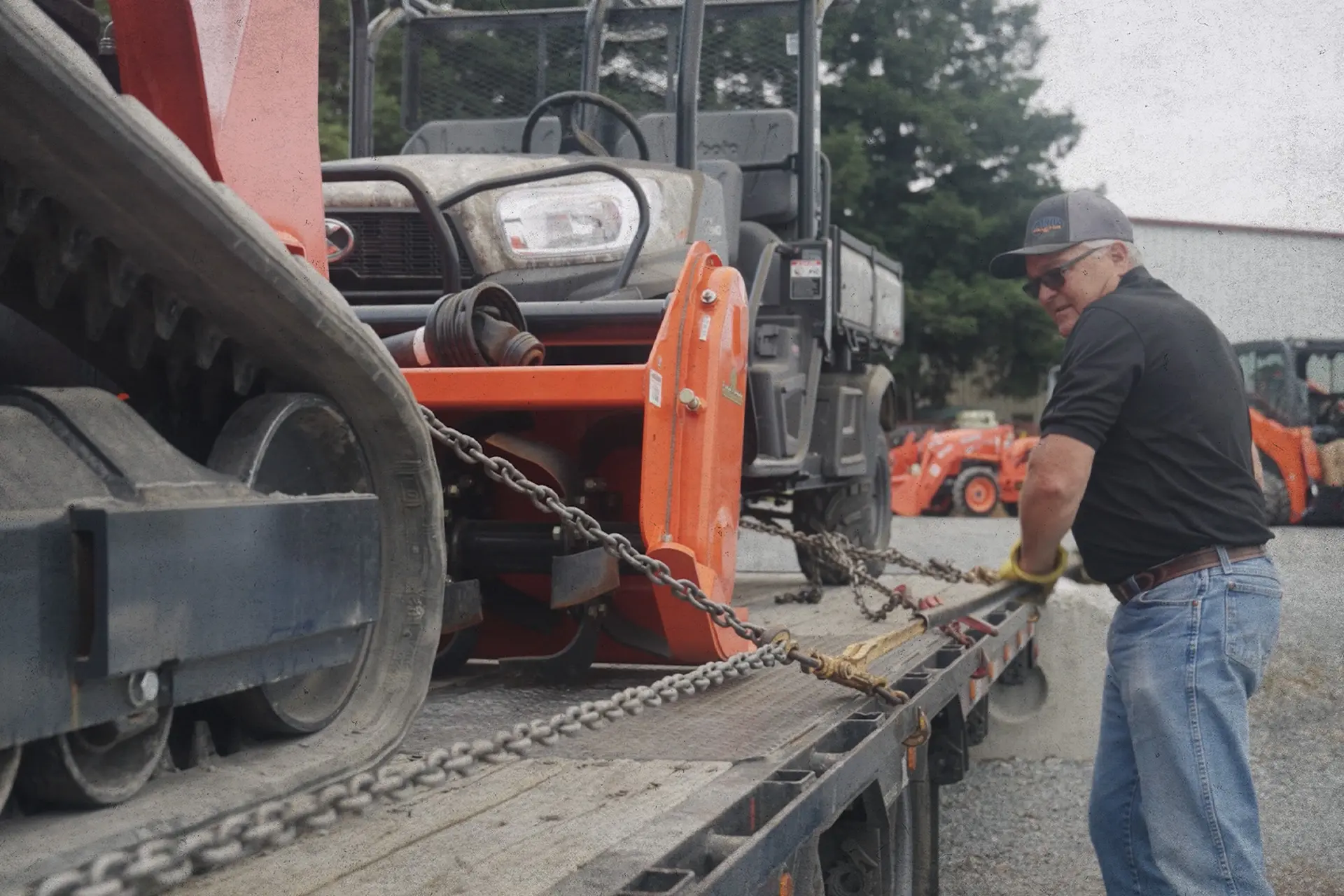 Man loading equipment on trailer